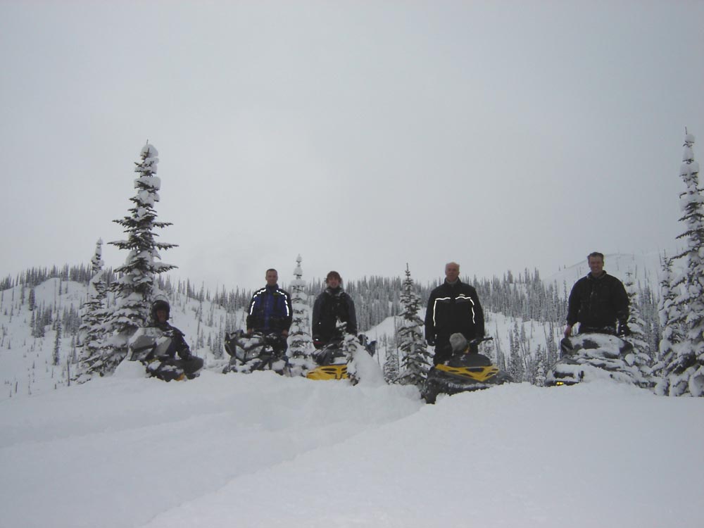 Clayton, Josh, Dan, and Calvin - A lively, snowy image capturing the team at Hi-Torque Rollers with Ski-Doo snowmobiles in March 2008.