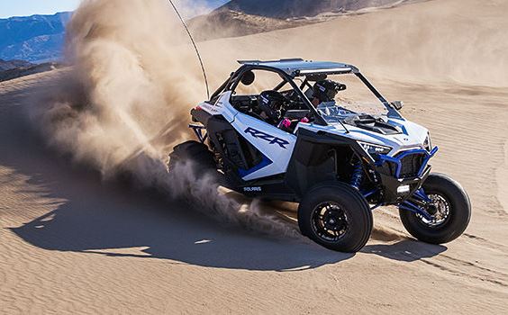 An action image showcasing the sleek design and performance of a Polaris RZR with Hi-Torque Rollers.